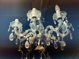 a glass chandelier hanging from the ceiling