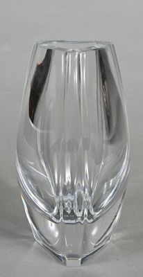 a glass vase that is sitting on a table
