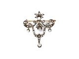 an antique diamond and gold broochle broochle