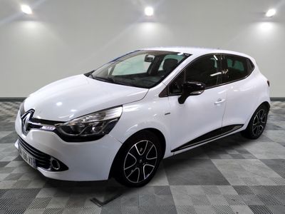 the white car is parked on a checkered tile floor