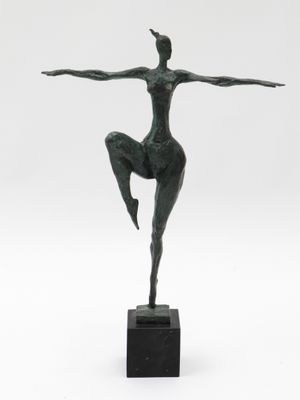 an image of a bronze statue of a woman in a pose