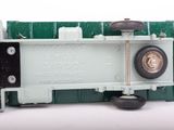 a close up of a toy train car on a white surface