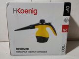 une boîte contenant un sèche-cheveux jaune et noir