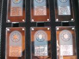 six plaques in a black case that are on display