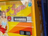 a pinball machine that has a pinball girl on it
