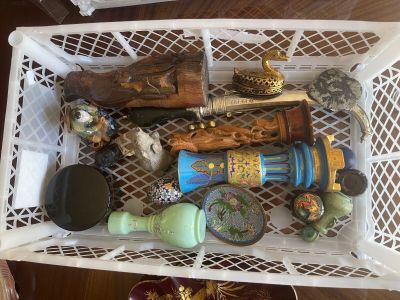 a white basket filled with assorted items on a table