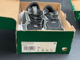 a box with a pair of running shoes in it