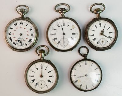 four antique pocket watches with roman numerals and roman numerals on them
