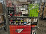 a metal cart with many items in it in a warehouse