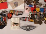 a lot of medals and other items on the table