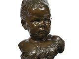 bronze bust of a young boy with hands on his chest