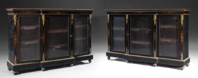 pair of antique black and gold display cabinets with glass doors