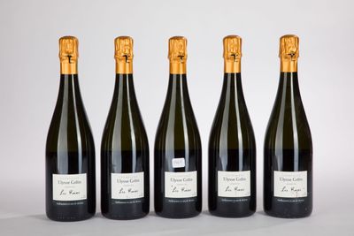 four bottles of wine lined up in a row