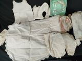 a lot of clothing that is laying out on a black surface