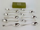 a lot of spoons that are sitting on a table