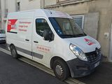 a white van that is parked on the side of the street
