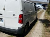 a white van that is parked on the side of the road