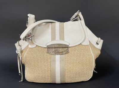 beige and white handbag on black background with silver hardware