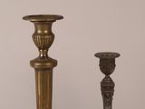 two candles sitting next to each other on a table