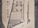 a drawing of a plan on a piece of paper on the floor