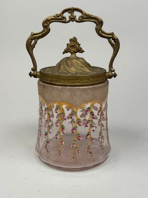 an image of a pink glass jar with a gold lid