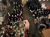 a large amount of bottles and cans of alcohol on the floor
