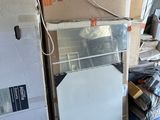 many boxes stacked on top of each other in a room