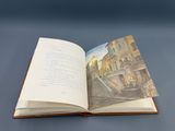 an open book with a picture of a building on it