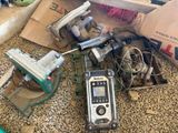 a pile of assorted items on the floor next to a box