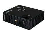 un projecteur noir posé sur une surface blanche