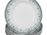 four plates stacked on top of each other on a white surface