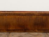 a wooden box that is sitting on the floor