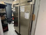 an image of a commercial kitchen with stainless steel refrigerators