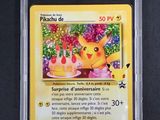 a close up of a pokemon card in a plastic case