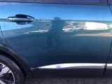 a car that has been painted blue and has a sticker on the side of it