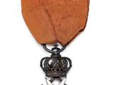 l'image d'une médaille surmontée d'une étoile