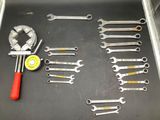 a lot of wrenches that are sitting on a table