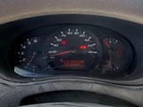 a close up of a dashboard with a speedometer