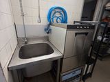 a small kitchen with a sink and a dishwasher in it