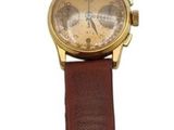 wrist watch with brown leather strap on white background on white surface