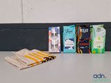 a table with a towel, toothbrushes, and a bag of toothpaste