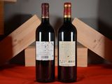 two bottles of wine sitting next to each other on a table