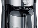 an image of a coffee maker that is sitting on a white surface