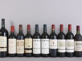 several bottles of wine are lined up in a row on a table