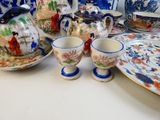 a table with a lot of different plates and cups on it