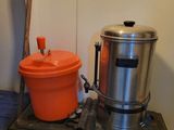 pots and pans are sitting on top of a stove in a room