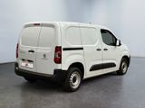 a picture of a white van parked in a room