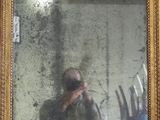 reflet d'un homme en train de se prendre en photo dans un miroir