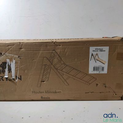 a cardboard box that has a picture of a man on a swing