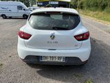 a white car that is parked on the side of the road
